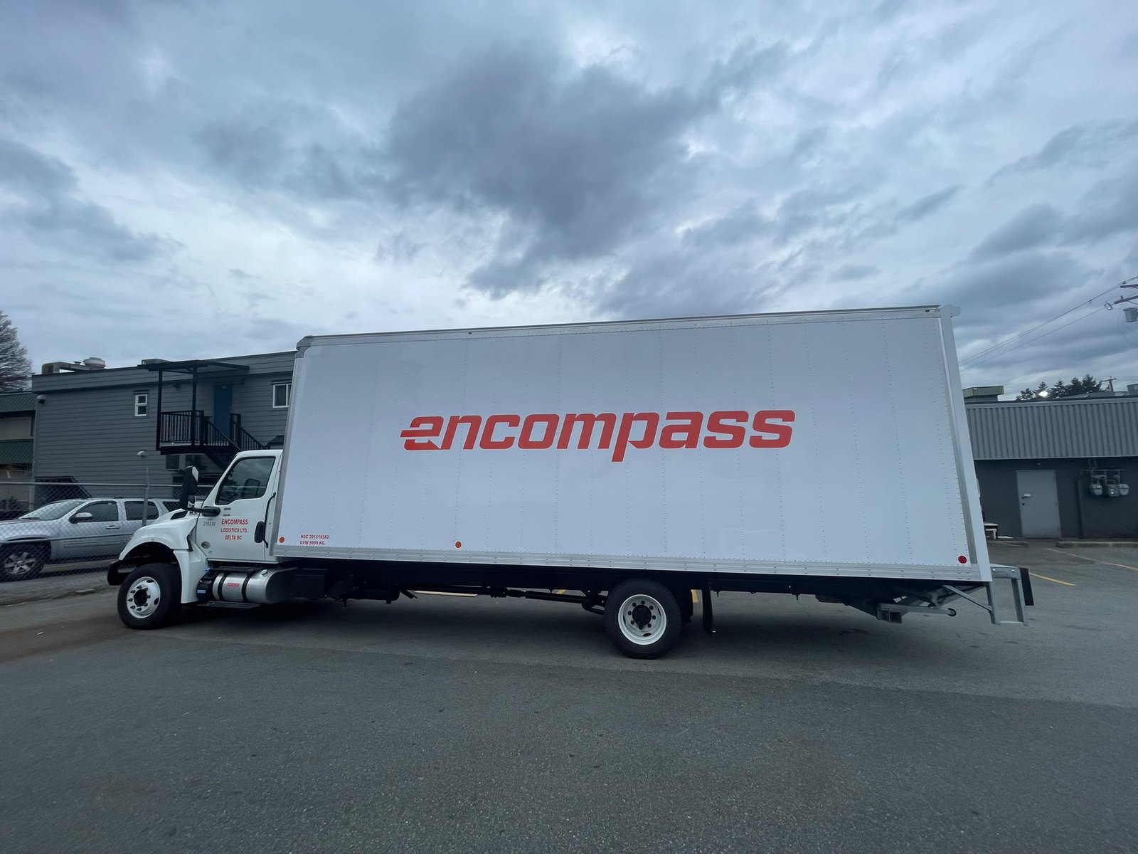 Encompass commercial box truck with branded side graphics