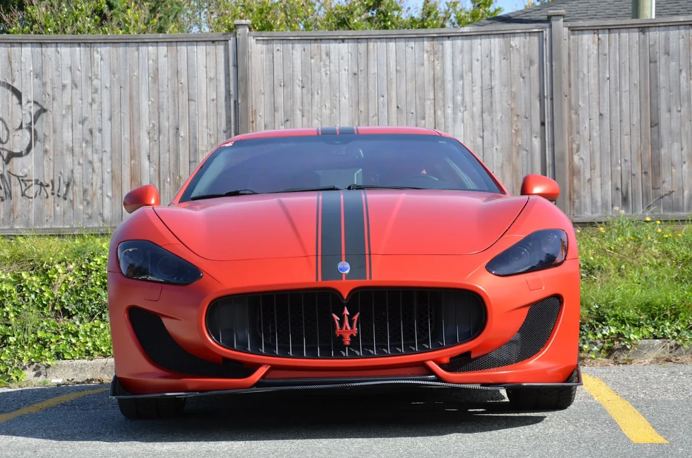 Front view of a Maserati GranTurismo with custom stripes in Surrey