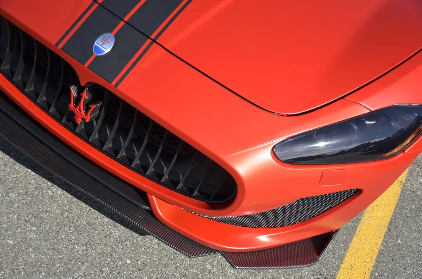 Close view of custom hood stripes on a Maserati GranTurismo